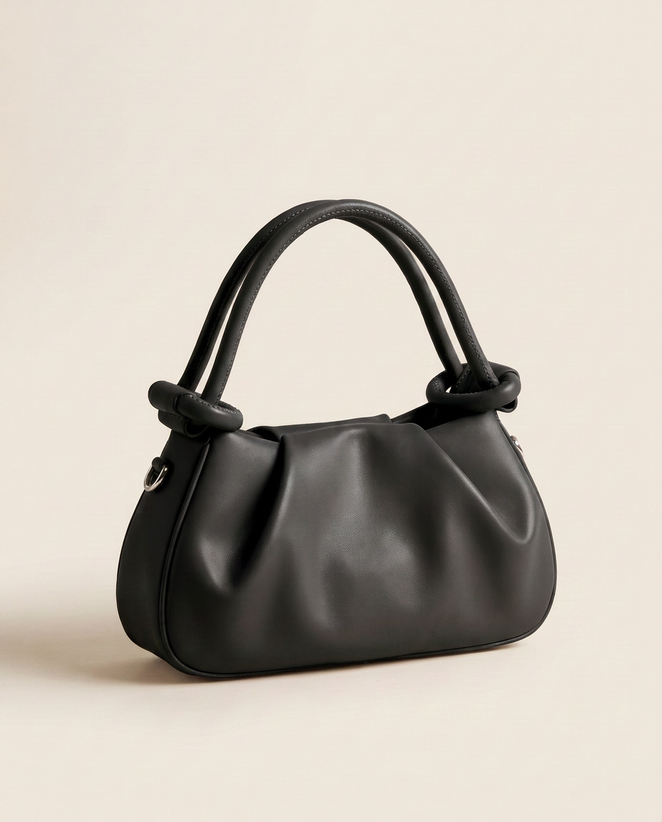 Mini bolso plisado Élan de CASVELO en color Negro