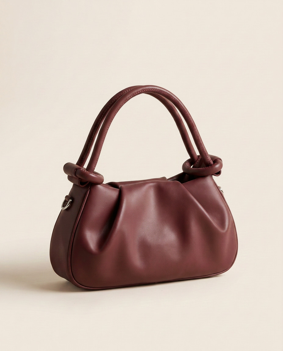 Mini bolso plisado Élan de CASVELO en color Burdeos