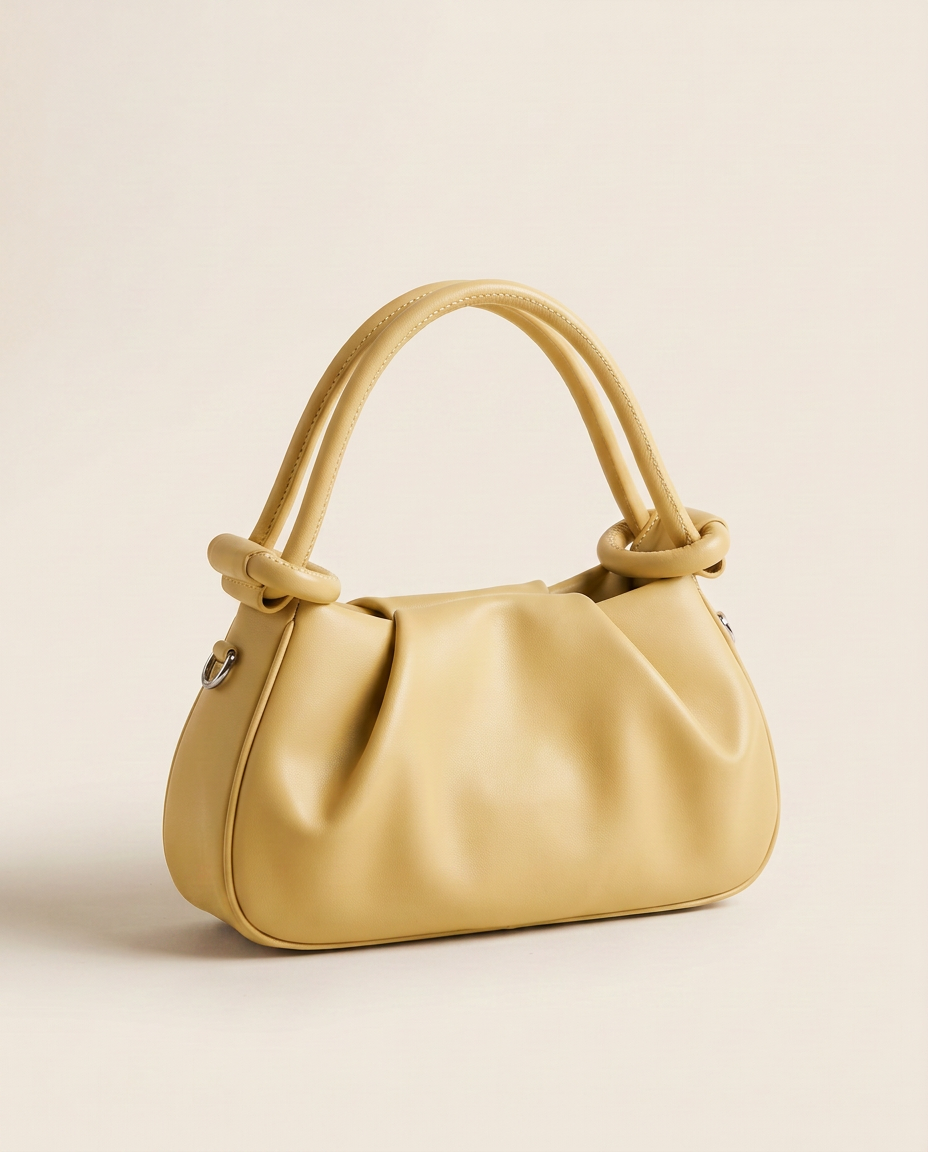 Mini bolso plisado Élan de CASVELO en color Mantequilla